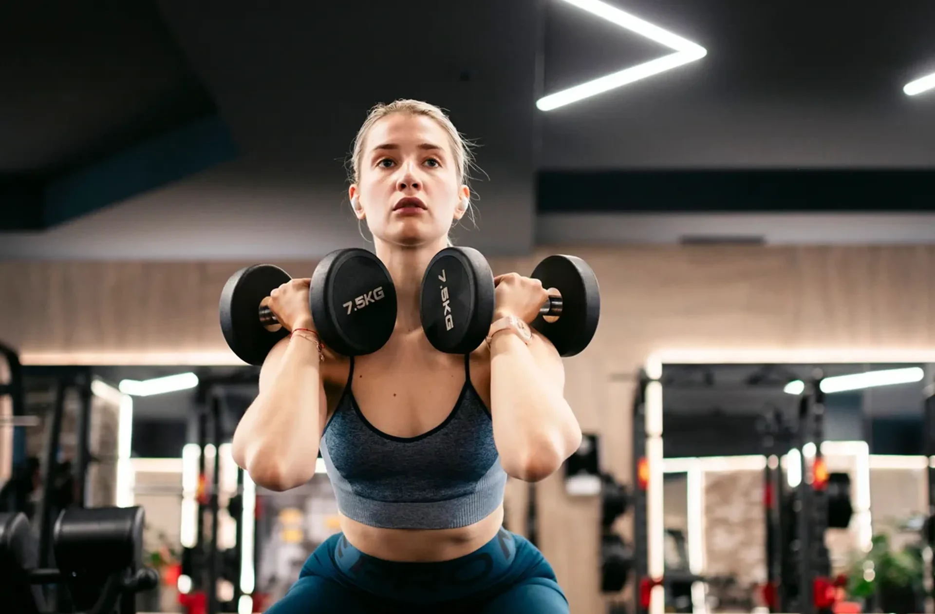 Focused woman doing strength training